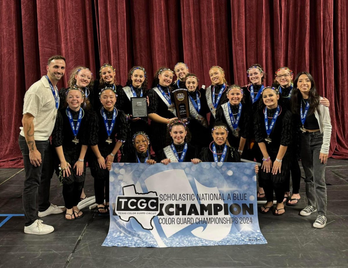 The Grand Oaks Color Guard with their first place medals and banner at TCGC State contest with director Trace Brown. 
Photo used from Trace Brown.